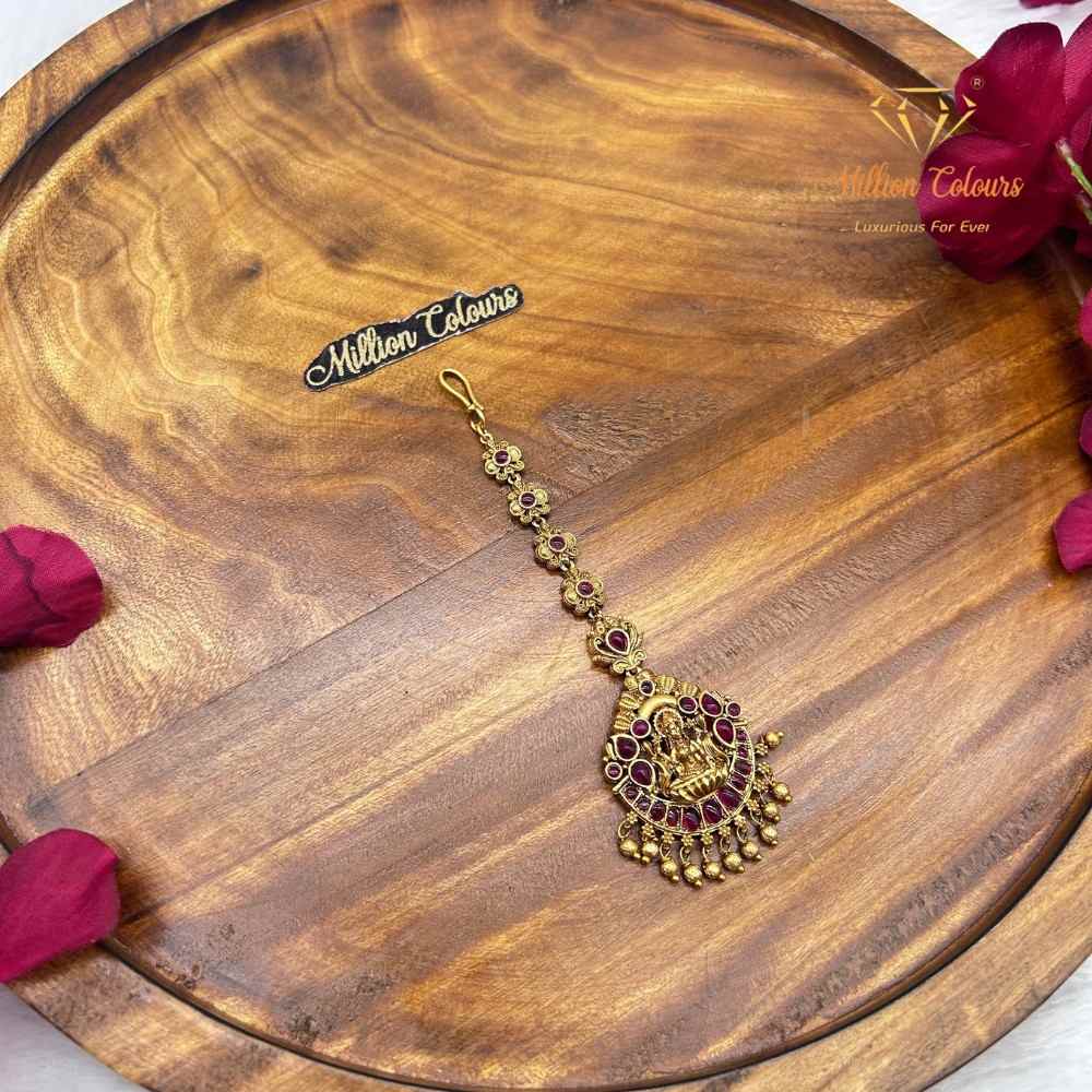 Elegant Ruby Stone Peacock Neththichutti – Traditional Gold Finish By Million Colous